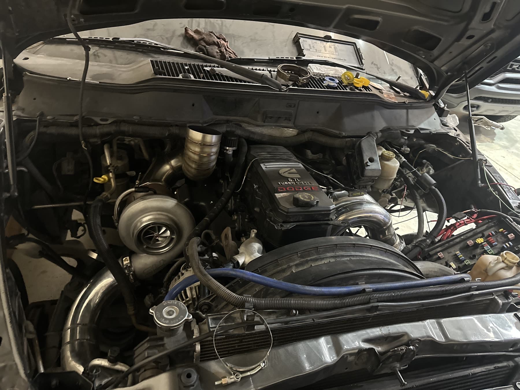 Technician inspecting a diesel engine bay