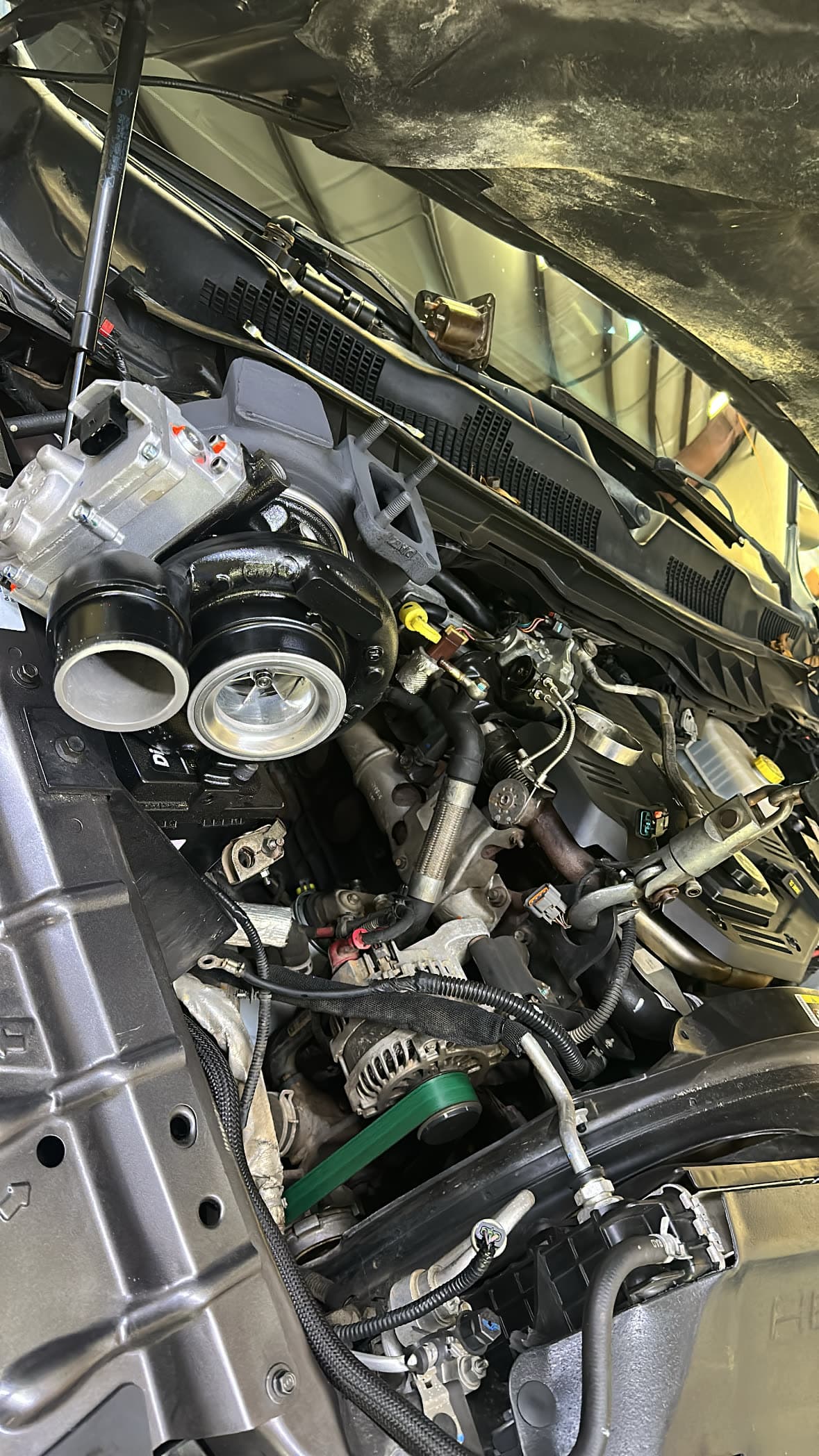 Mechanic using hand tools on an engine