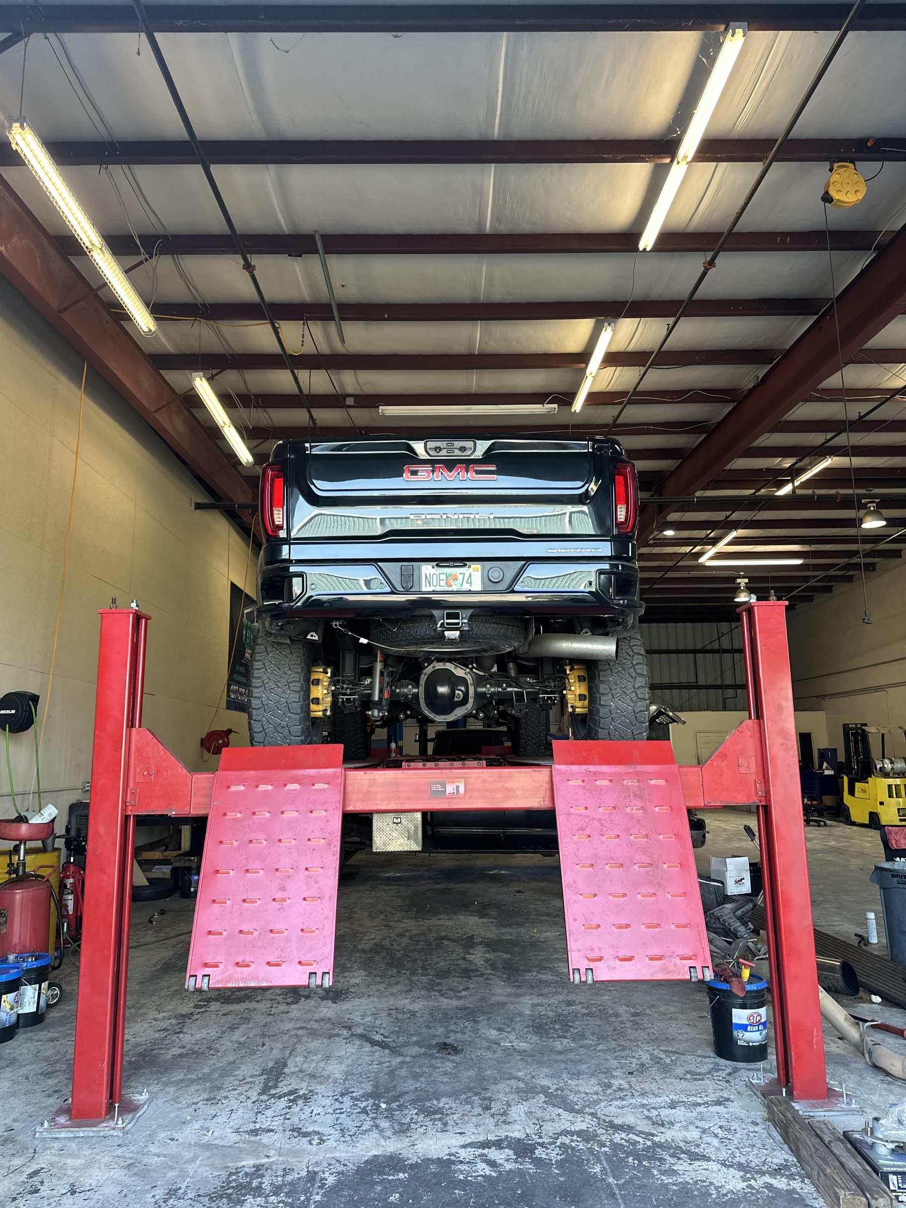 Truck on a lift inside a workshop